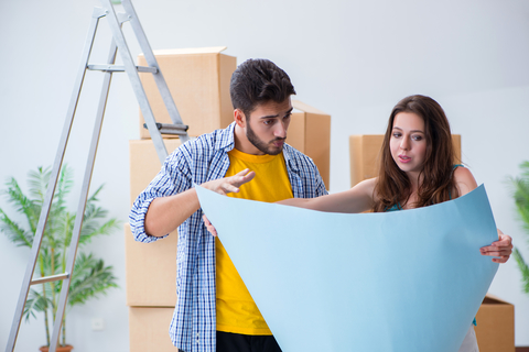 Young couple planning refurbishing