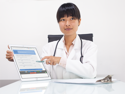 Photo of a doctor with a survey form on an iPad