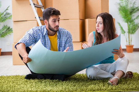 Photo of a young couple planning to refurbish their apartment