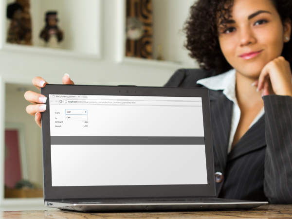 Photo of a woman with a screen showing the currency converter calculator used in the tour